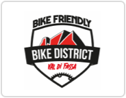 Val di Fassa Bike Friendly<br>Selected accommodation facilities with specialised services for bikers and cyclists (info corner, bike washing area, bike deposit, guided tour)