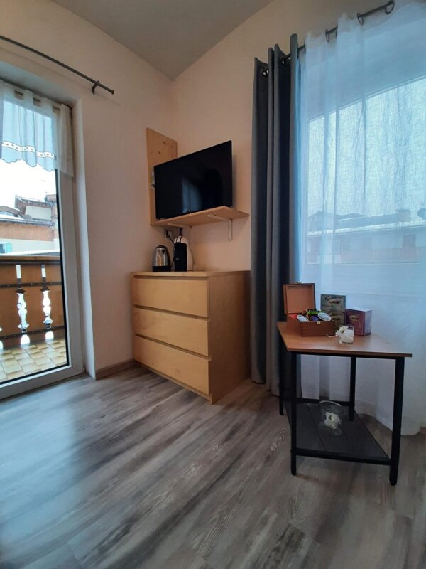 Tv and windows double bedroom