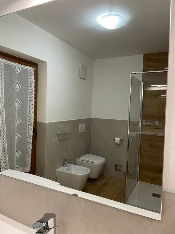 bathroom with shower and washing machine